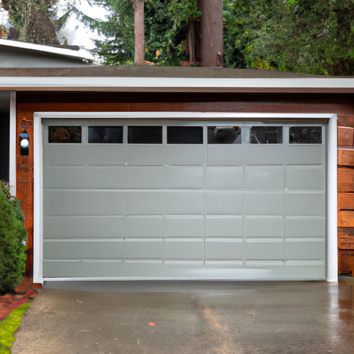 Insulated sectional garage door in a Seattle home with visible weatherstripping on a wet overcast day