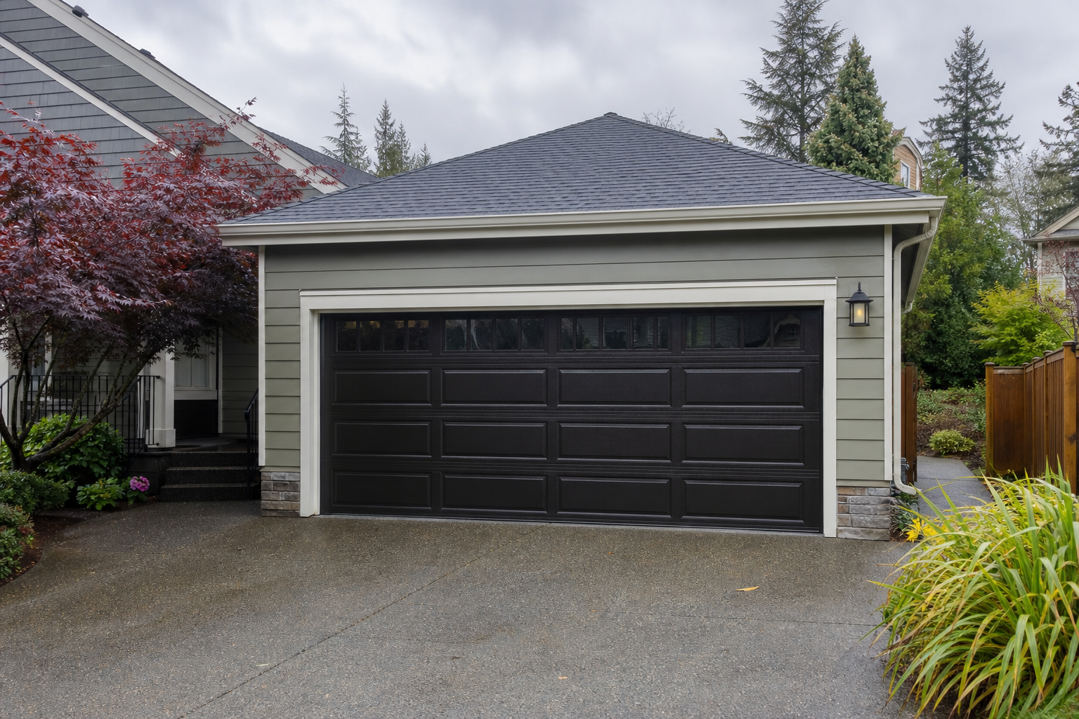 Residential garage door in Seattle on a cloudy day with a quiet neighborhood setting